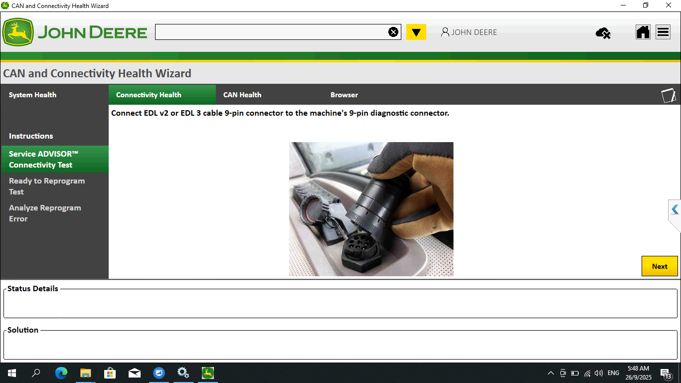 Computer screen displaying John Deere software with a diagnostic tool image.